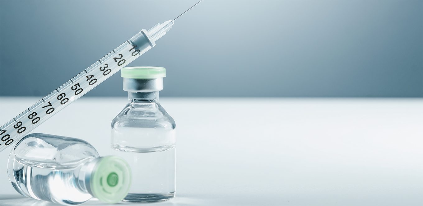 Vaccin och spruta